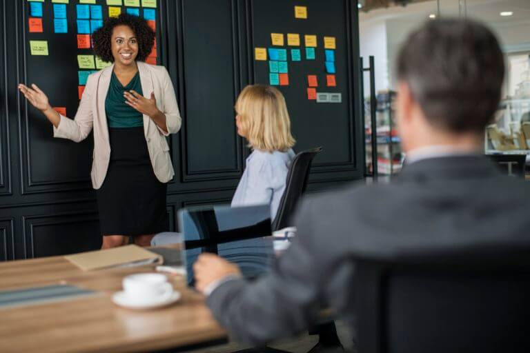 woman giving boardroom presentation