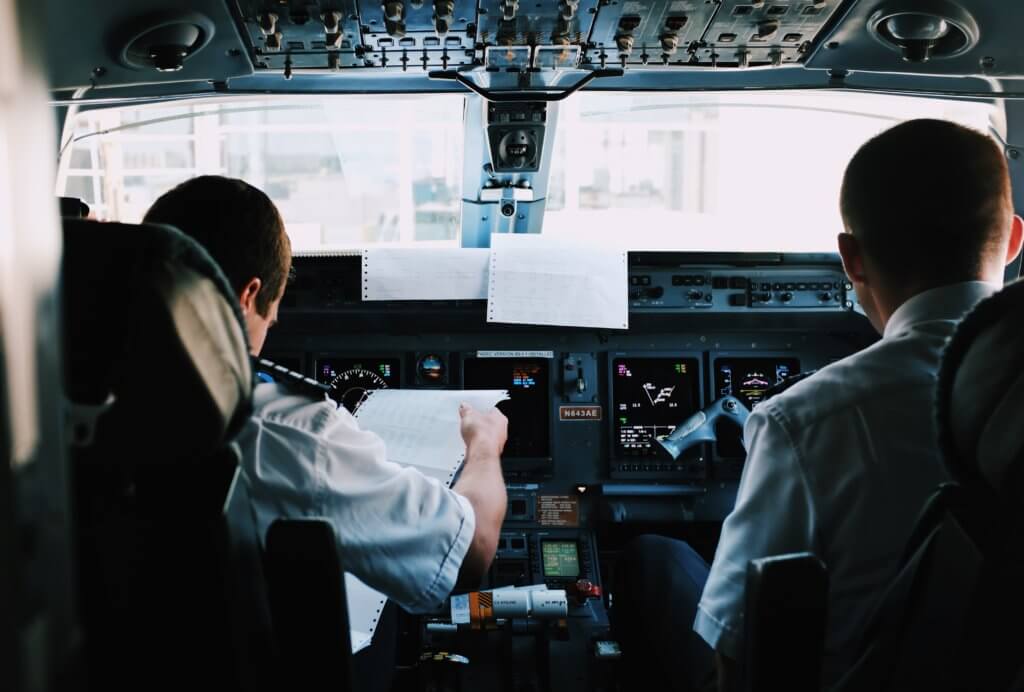 two pilots in airplane cockpit